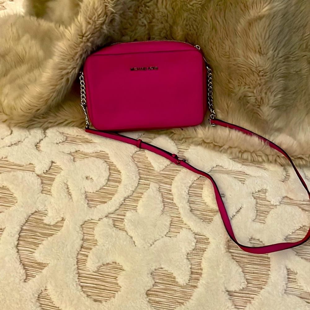 Fuchsia colored Michael Kors purse and wallet